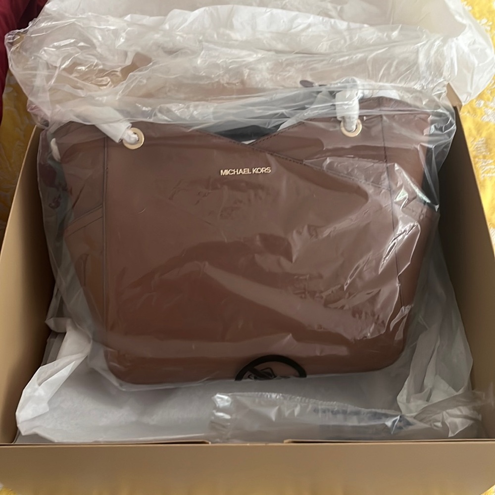 Brand new. Never opened brown leather Michael Kors large shoulder tote.